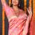 Light pink banarasi silk blend saree with floral jaal & zari border