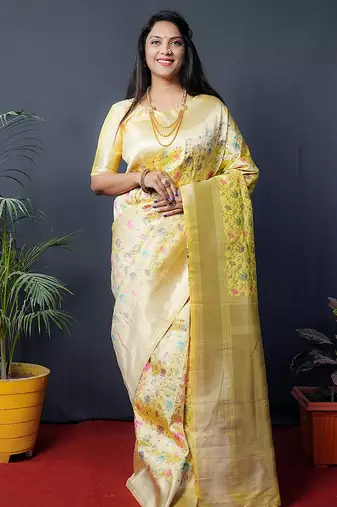 Lemon yellow banarasi silk blend saree with floral jaal & zari border