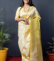 Lemon yellow banarasi silk blend saree with floral jaal & zari border