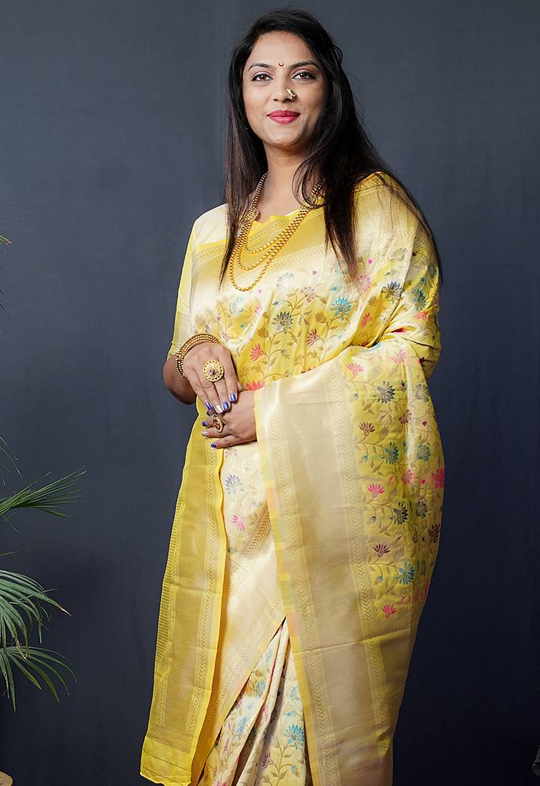 Lemon yellow banarasi silk blend saree with floral jaal & zari border
