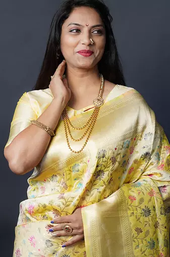 Lemon yellow banarasi silk blend saree with floral jaal & zari border