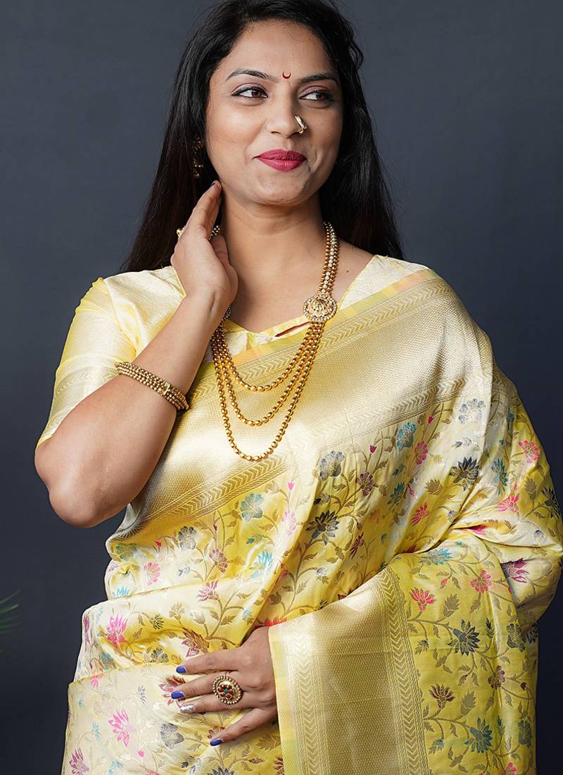 Lemon yellow banarasi silk blend saree with floral jaal & zari border