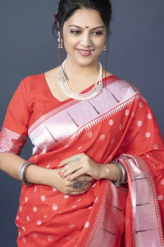 Red silk blend saree with silver zari booti & traditional floral pallu
