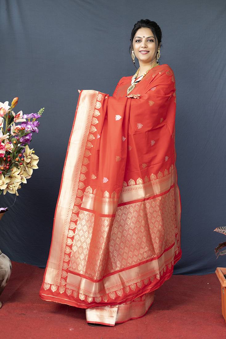 Red banarasi silk blend saree with silver zari border & woven pallu