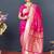Rani pink banarasi silk blend saree with silver zari border & woven pallu