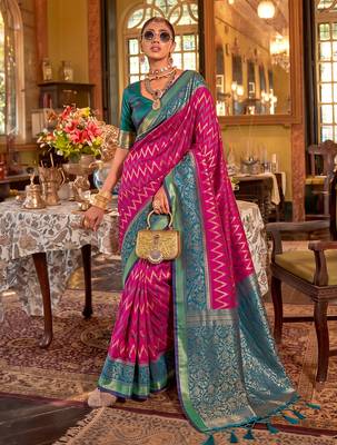 rani pink banarasi silk blend saree with teal border | women's royal wedding attire 1