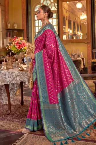 rani pink banarasi silk blend saree with teal border | women's royal wedding attire