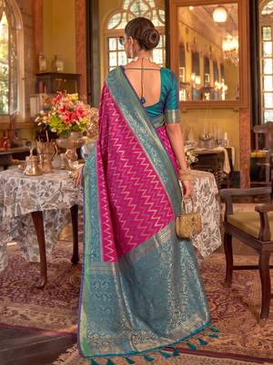 rani pink banarasi silk blend saree with teal border | women's royal wedding attire 3