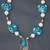 Floral Turquoise, White and Silver Leaf.