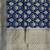  blue banarasi silk blend saree with floral zari & red minakari work