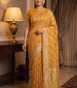 mustard banarasi silk blend saree with floral zari &  minakari work
