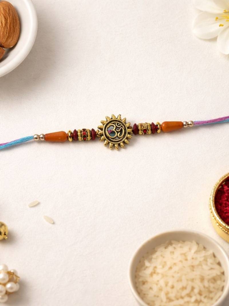 gold plated om designer rakhi with roli chawal & raksha bandhan card