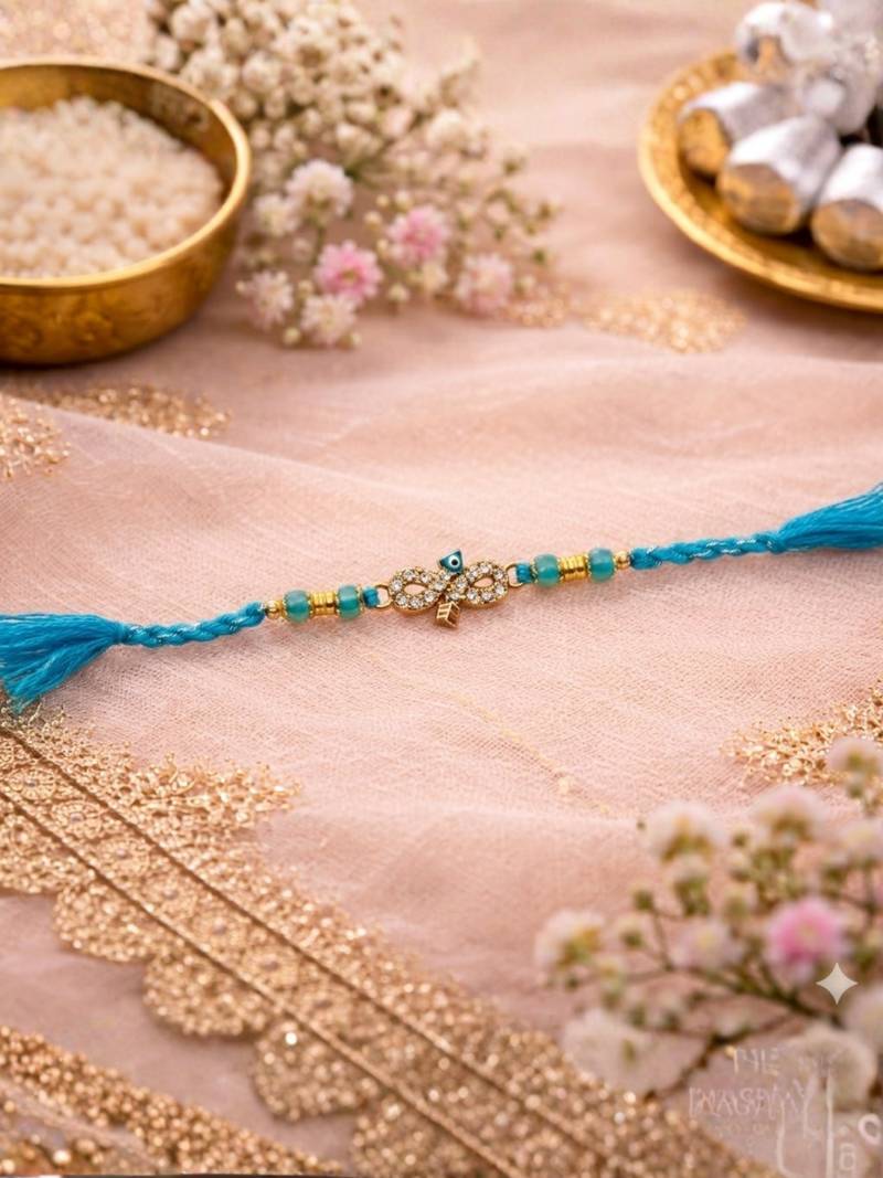evil eye designer rakhi for brother with roli chawal & raksha bandhan card