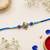traditional floral designer rakhi with roli chawal & raksha bandhan card