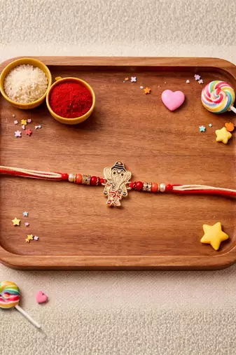 ganesha designer rakhi with roli chawal & raksha bandhan card for brother