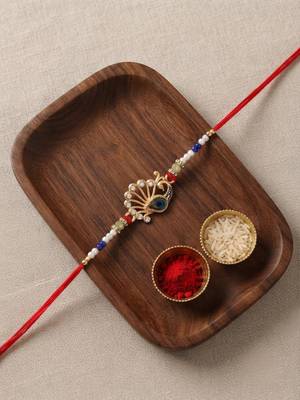 peacock design rakhi with roli chawal and raksha bandhan card 1