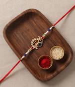 peacock design rakhi with roli chawal and raksha bandhan card