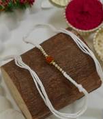traditional rudraksha rakhi with roli chawal and raksha bandhan card