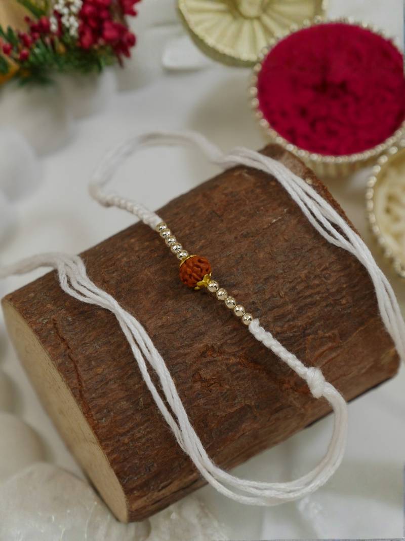 traditional rudraksha rakhi with roli chawal and raksha bandhan card
