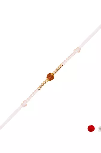 traditional rudraksha rakhi with roli chawal and raksha bandhan card