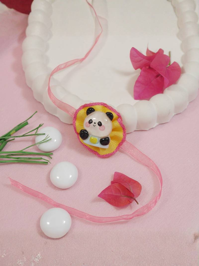 cute panda theme kids rakhi with roli chawal and raksha bandhan card
