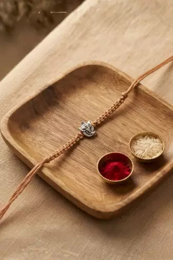 ganesha designer rakhi with roli chawal and raksha bandhan card