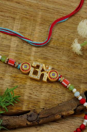 om designer rakhi with roli chawal and raksha bandhan card