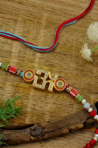 om designer rakhi with roli chawal and raksha bandhan card
