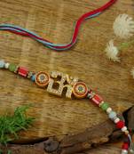 om designer rakhi with roli chawal and raksha bandhan card