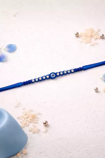 evil eye theme designer rakhi with roli chawal and raksha bandhan card