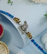 ganesha designer blue rakhi with roli chawal and raksha bandhan card