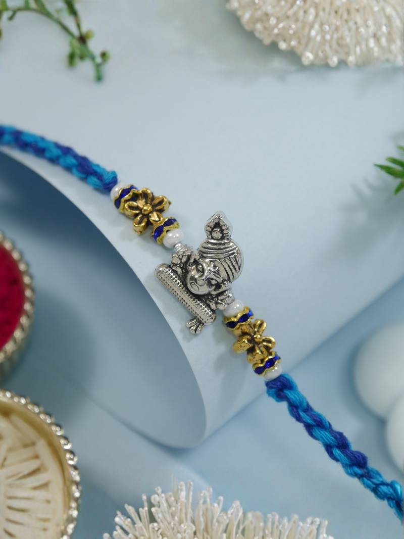 ganesha designer blue rakhi with roli chawal and raksha bandhan card