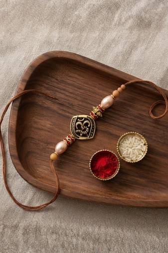 om designer rakhi with roli chawal and raksha bandhan card