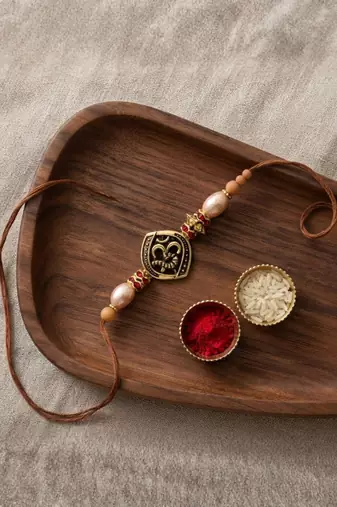 om designer rakhi with roli chawal and raksha bandhan card