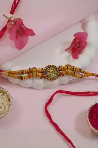 ganesha designer rakhi with roli chawal and raksha bandhan card