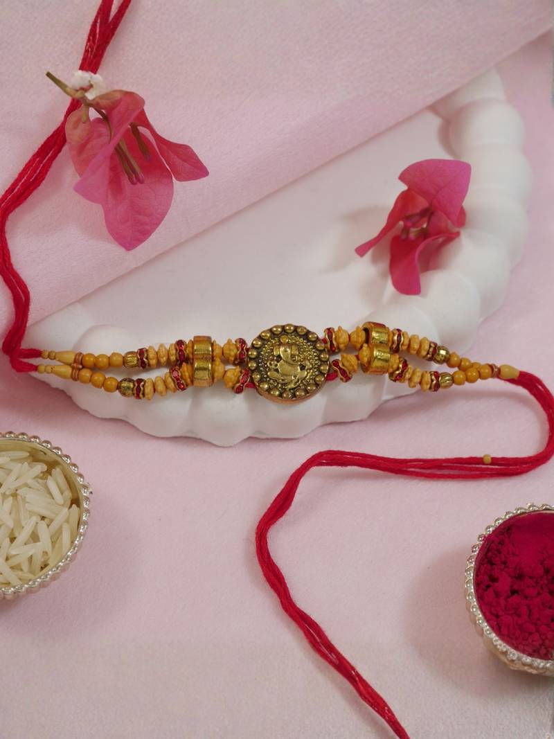 ganesha designer rakhi with roli chawal and raksha bandhan card
