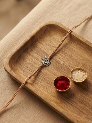 ganesha design rakhi with roli chawal and raksha bandhan card 1
