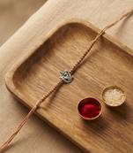 ganesha design rakhi with roli chawal and raksha bandhan card
