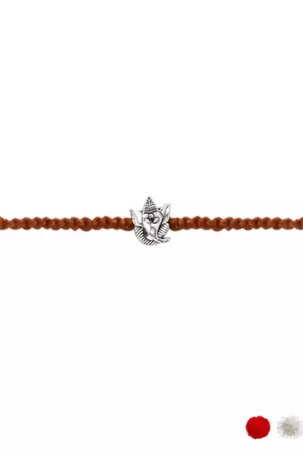 ganesha design rakhi with roli chawal and raksha bandhan card