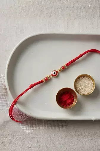 evil eye designer rakhi with roli chawal and raksha bandhan card