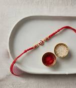 evil eye designer rakhi with roli chawal and raksha bandhan card