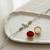 ganesha design rakhi with roli chawal and raksha bandhan card