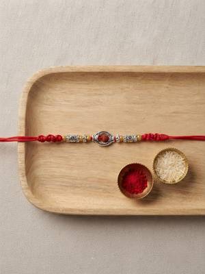 rudraksha designer rakhi with roli chawal and raksha bandhan card 1