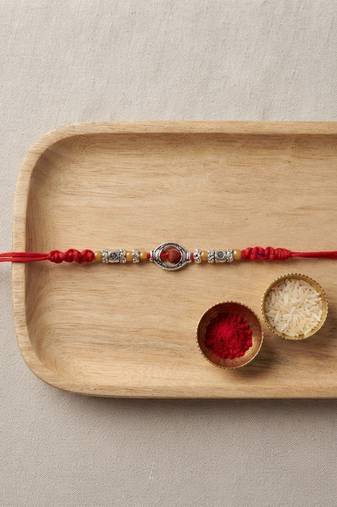 rudraksha designer rakhi with roli chawal and raksha bandhan card
