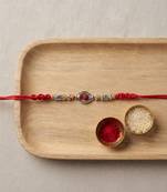 rudraksha designer rakhi with roli chawal and raksha bandhan card