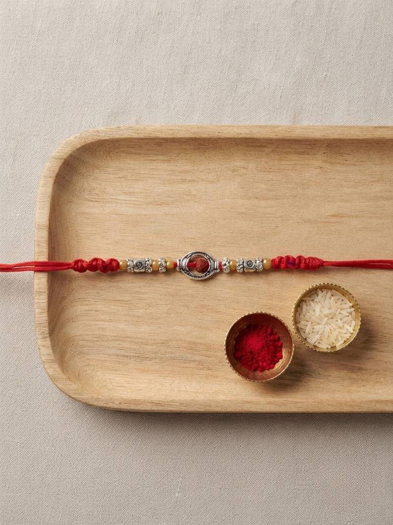 rudraksha designer rakhi with roli chawal and raksha bandhan card