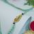 peacock feather designer rakhi with roli chawal and raksha bandhan card