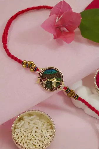 krishna flute designer rakhi with roli chawal and raksha bandhan card
