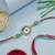 evil eye designer rakhi with roli chawal and raksha bandhan card