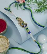 peacock feather designer rakhi with roli chawal and raksha bandhan card
